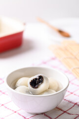 Tangyuan, Chinese dessert made of ball glutinous rice flour and filled with black sesame in ginger soup or syrup