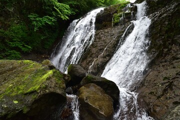 Fototapeta premium trekking around waterfall in summer