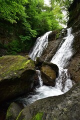 trekking around waterfall in summer