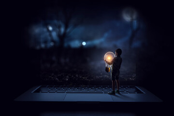 Boy with a glowing light bulb