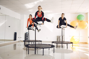 Jumping young women on a trampoline