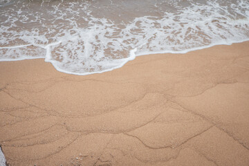 sea scape with sea wave and sandy beach when summer time. the photo perfect for holidays background, nature pamphlet and advertising brochure. 