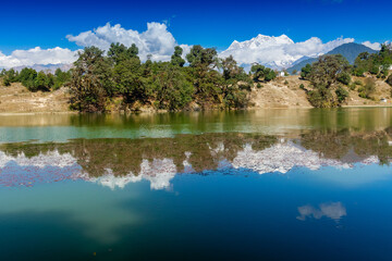 Naklejka premium Deoria Tal , also Devaria or Deoriya is a high altitude lake in Uttarakhand, India. Blue sky with snow-covered mountains, Chaukhamba is one of them, in the background.