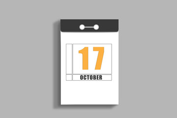 october 17. 17th day of month, calendar date.White page of tear-off calendar, on gray insulated wall. Concept of day of year, time planner, autumn month