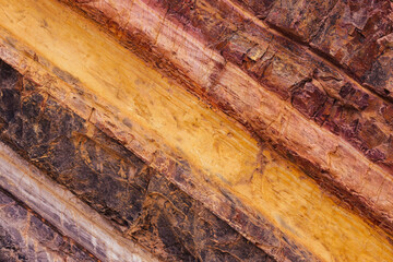 Coloured layer of a rock wall 