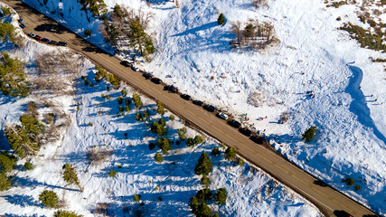 Aerial View of Road in Snow Covered Mountain Rigde