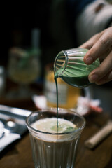 pouring coffee into a cup