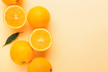 Fresh ripe oranges on color background