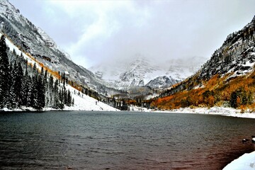 The Maroon Bells are two peaks in the Elk Mountains, Maroon Peak and North Maroon Peak, separated...