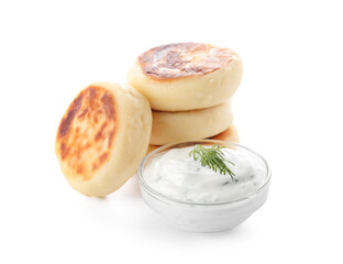 Fototapeta na wymiar Tasty cottage cheese pancakes and sauce on white background