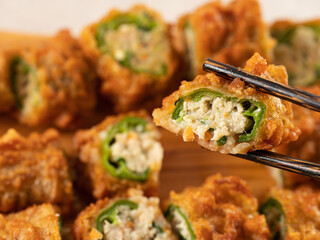 Close-up of minced meat and vegetables with fried chili pepper stuffing