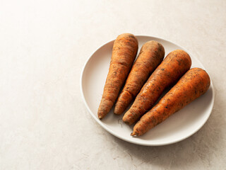 Fresh carrots on marble background 