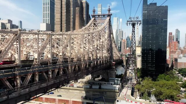 Riding the Roosvelt Island Tramway gondola to Manhattan New York with Ed Koch Queensboro Bridge and skyscrapers