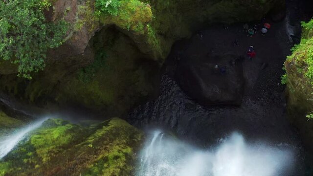 Powerful Waterfall Gljufrabui In The Cave In Iceland - aerial drone shot