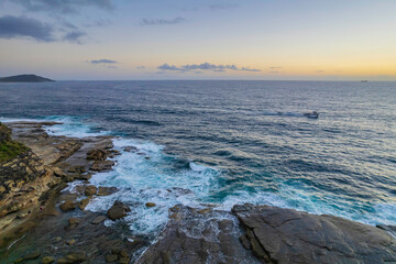 Aerial Sunrise Seascape at Rocky Inlet with clouds