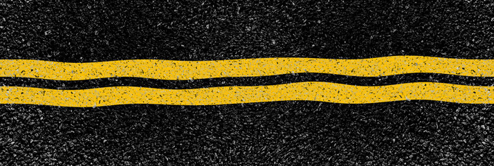 Double bande jaune sur asphalte déformé 