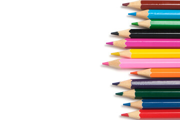 Bright colored pencils on a white background.School supplies for drawing.