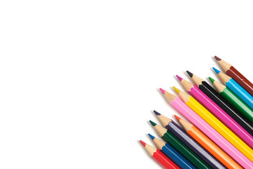 Bright colored pencils on a white background.School supplies for drawing.