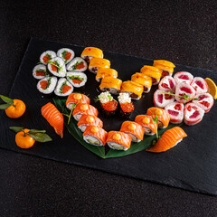 tasty sushi on the black background