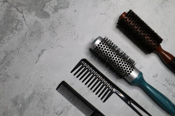 Professional tools for a barber shop on a gray background.