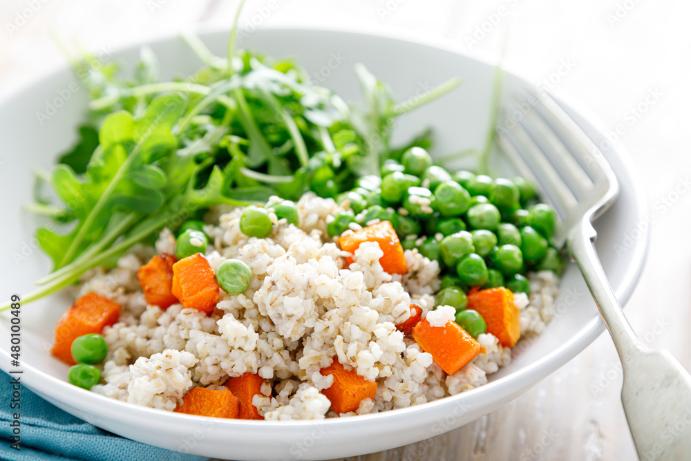 Sticker Barley porridge with green peas, baked pumpkin and fresh arugula salad