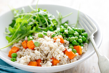 Barley porridge with green peas, baked pumpkin and fresh arugula salad