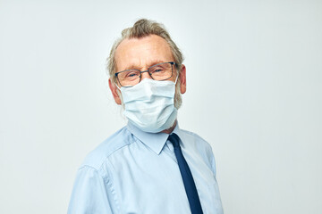 Photo of retired old man medical mask protection isolated background