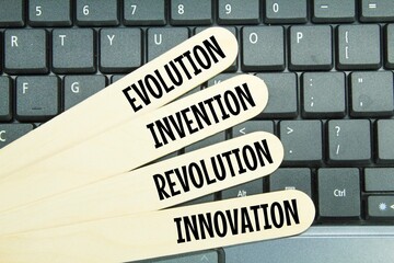 wooden ice cream sticks with the words innovation, invention, evolution and revolution