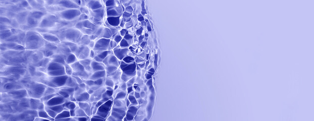 Very peri color of year 2022. Purple water surface with waves, splashes and bubbles. Water surface...