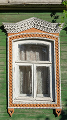 carved window of a wooden house