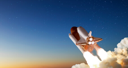 Spaceship takes off into the night sky on a mission. Rocket starts into space concept.Elements of...