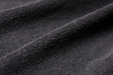Texture of black woolen fabric, dark tone pattern