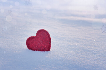 Fototapeta premium valentines day card red heart on sparkling winter snow, love concept