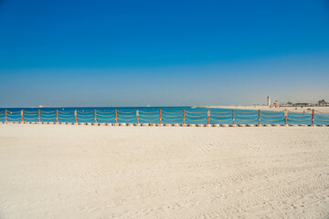 Kite Beach is a public beach in Dubai city in UAE. White sand, turquoise water, blue sky Dubai, United Arab Emirates.