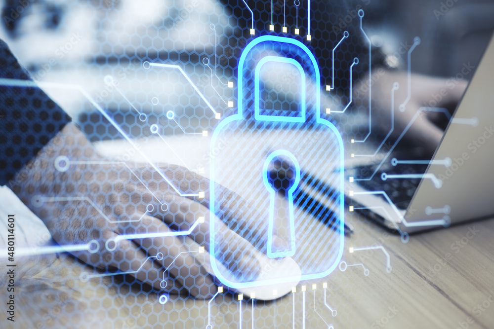Poster close up of businessman hands using laptop keyboard with abstract glowing blue padlock circuit holog
