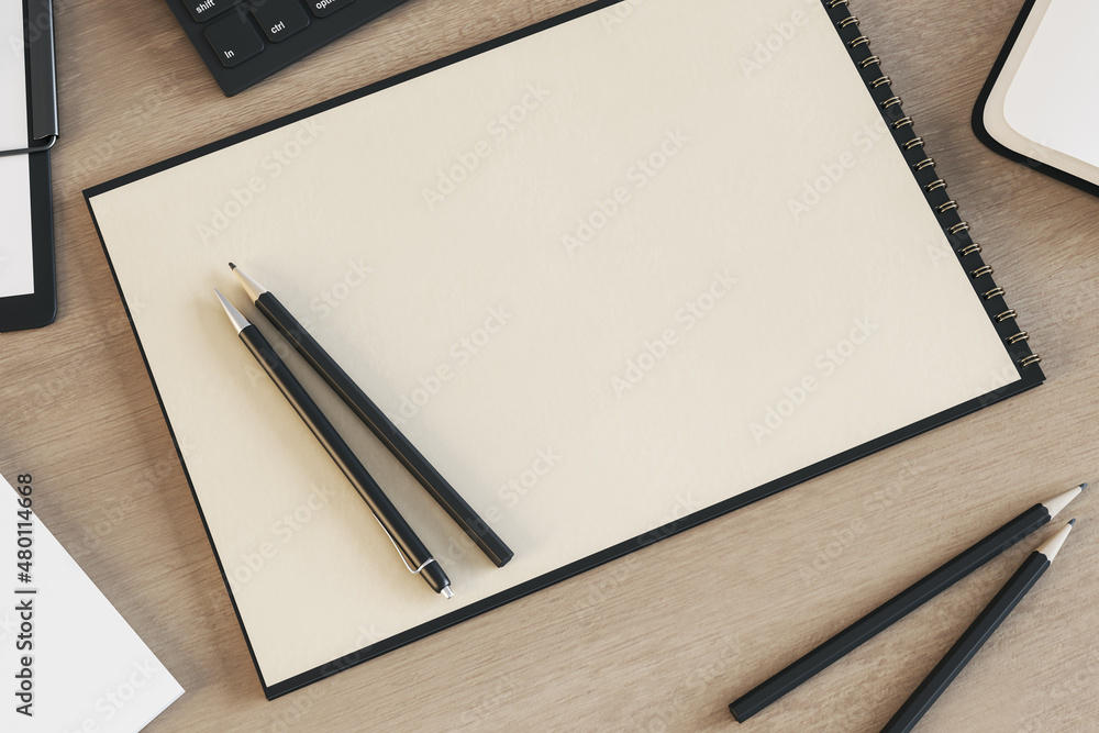 Poster top view of empty spiral notepad on wooden desktop with keyboard and pencils. drawing, workplace, su