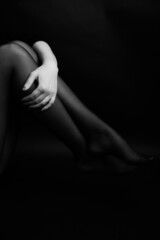 female body details close-up, black and white frame , defocusing