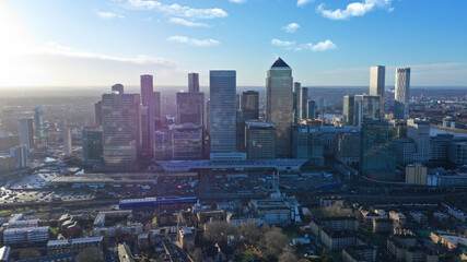 Aerial drone distant shot of iconic skyscraper banking and business complex of Canary Wharf, Docklands, London, United Kingdom