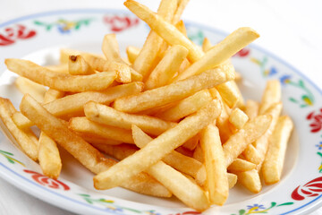 golden french fries on the wooden background