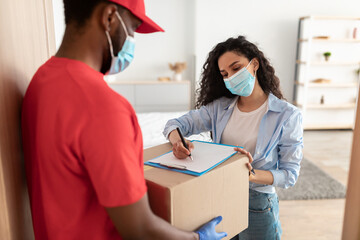 Customer In Medical Face Mask Receiving Order Signing Paper Form