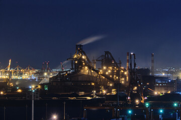 Fototapeta na wymiar Factories glowing in the night