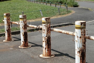 Old and rusty iron car stopper