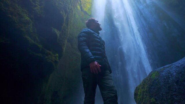 Man On Gljufrabui Waterfalls Hidden At Small Gorge In Southern Iceland. Handheld