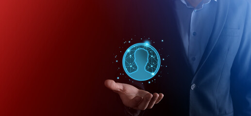 Fototapeta premium Businessman holding on hand icon of user man,woman low poly polygon style. Internet icons interface foreground. global network media concept.