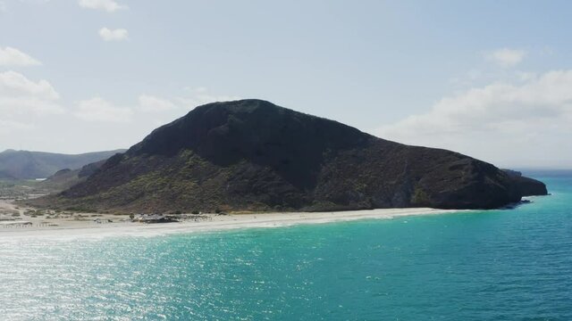 Drone pulls back over the water Tecolote Beach, Baja, Mexico