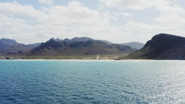 Drone flies high towards Tecolote Beach, Baja, Mexico