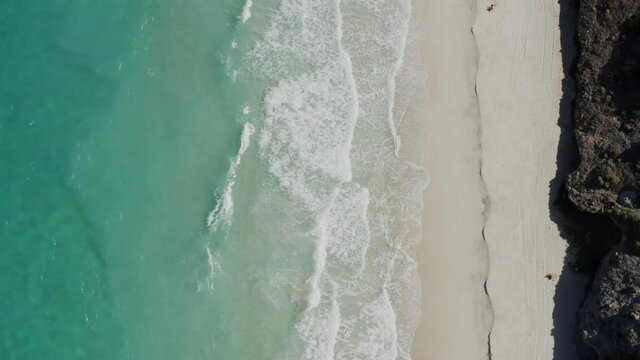 Drone films birdseye satellite view of Tecolote Beach Mexico
