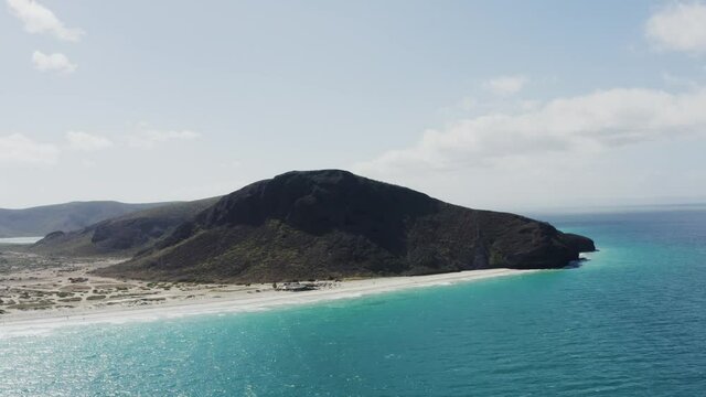 Drone flies towards the peaks of Tecolote Beach Baja, Mexico