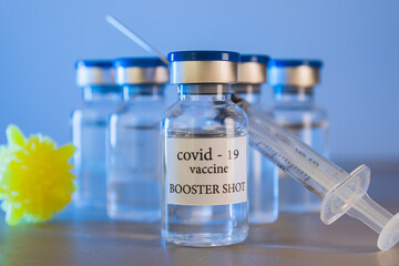 COVID-19 booster vaccine vials. Medicine and health care concept