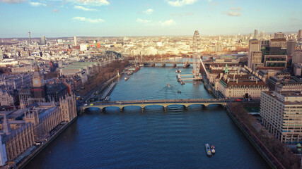 Obraz premium Aerial drone photo of iconic City of Westminster with houses of Parliament, Big Ben and Westminster Abbey in front of river Thames, London, United Kingdom
